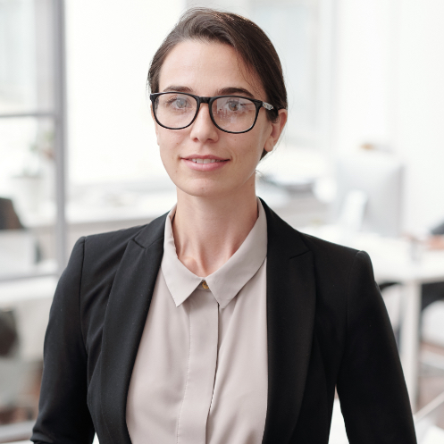 Portrait of a smiling female pharmacist in white lab coat