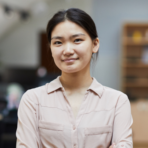 Pharmacist working behind the pharmacy counter, smiling
